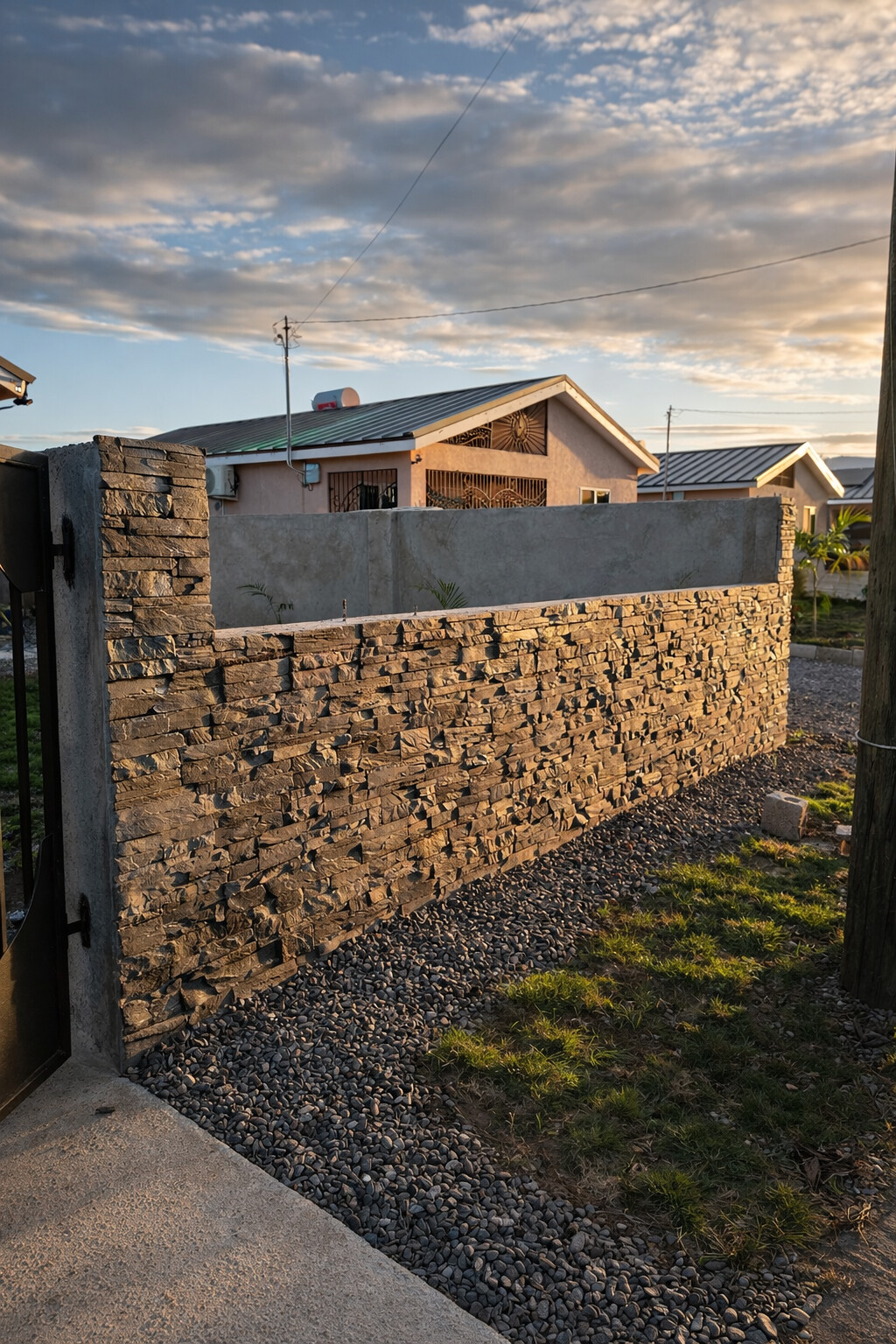 Charcoal boundary wall featuring ConCreate Rustic Stone Veneer