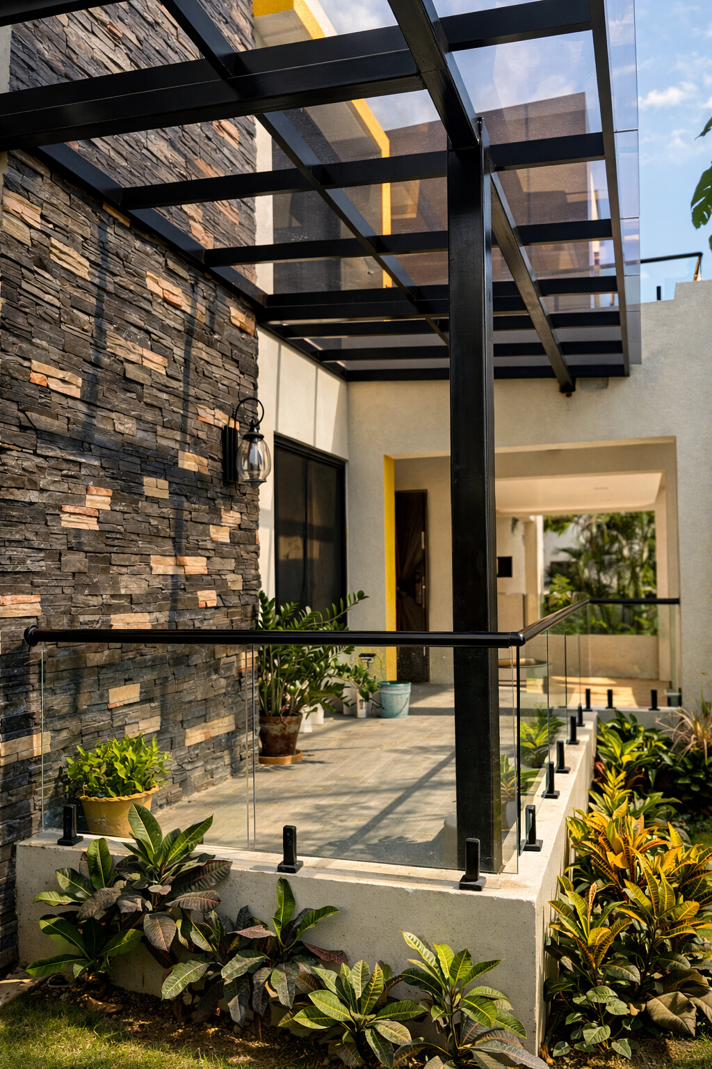 Canopy-side feature wall featuring ConCreate Rustic Stone Veneer