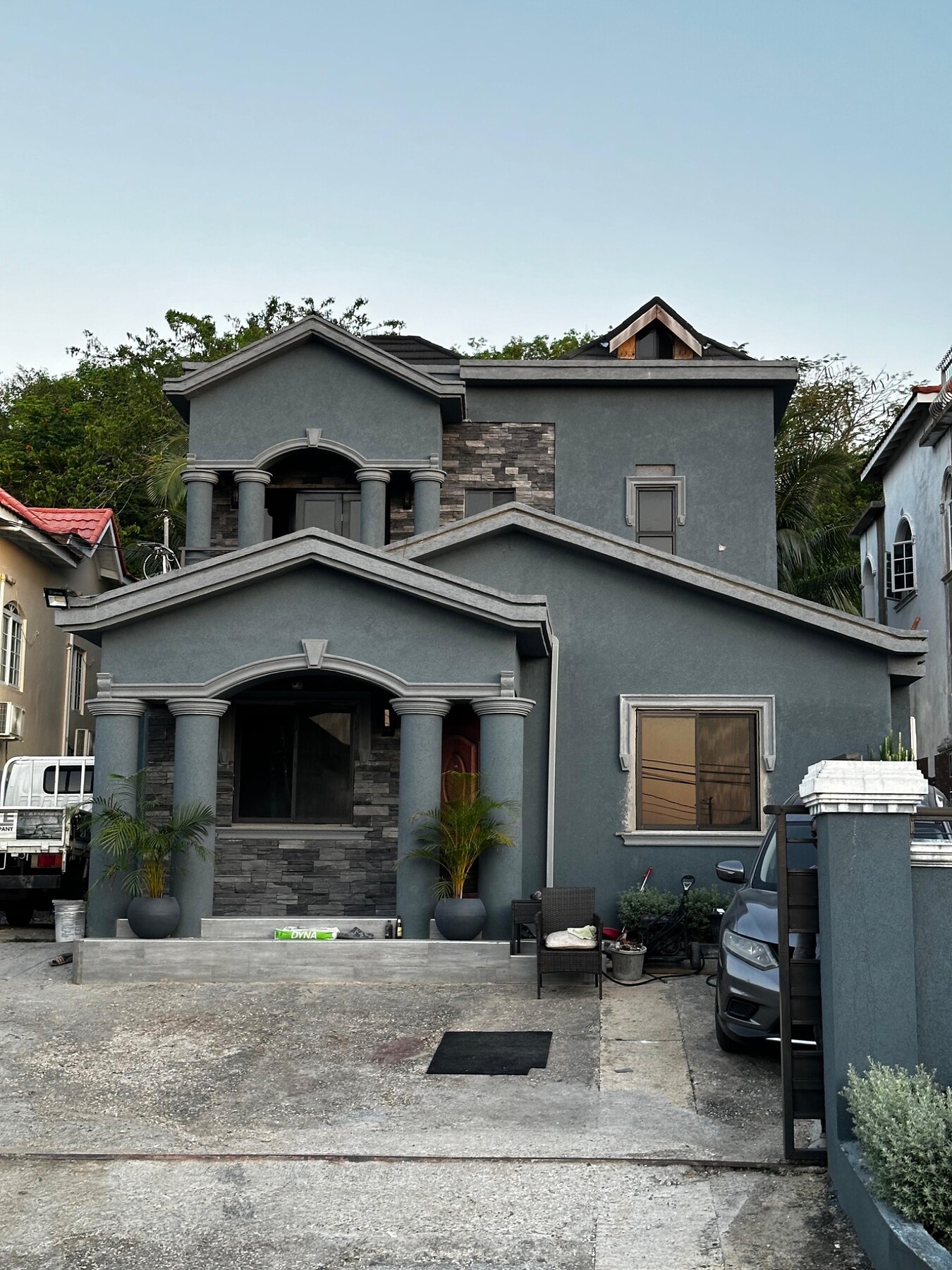 Entrance and upper-storey accents featuring ConCreate Rustic Stone Veneer