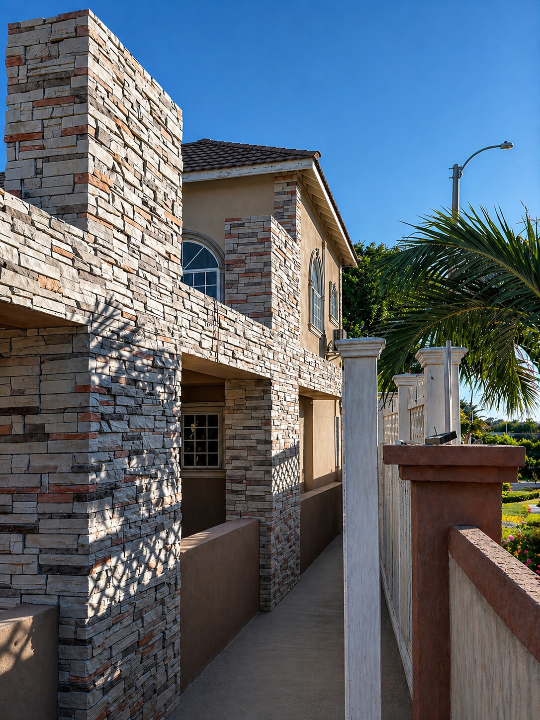 Sierra garden passage featuring ConCreate Rustic Stone Veneer · Sierra