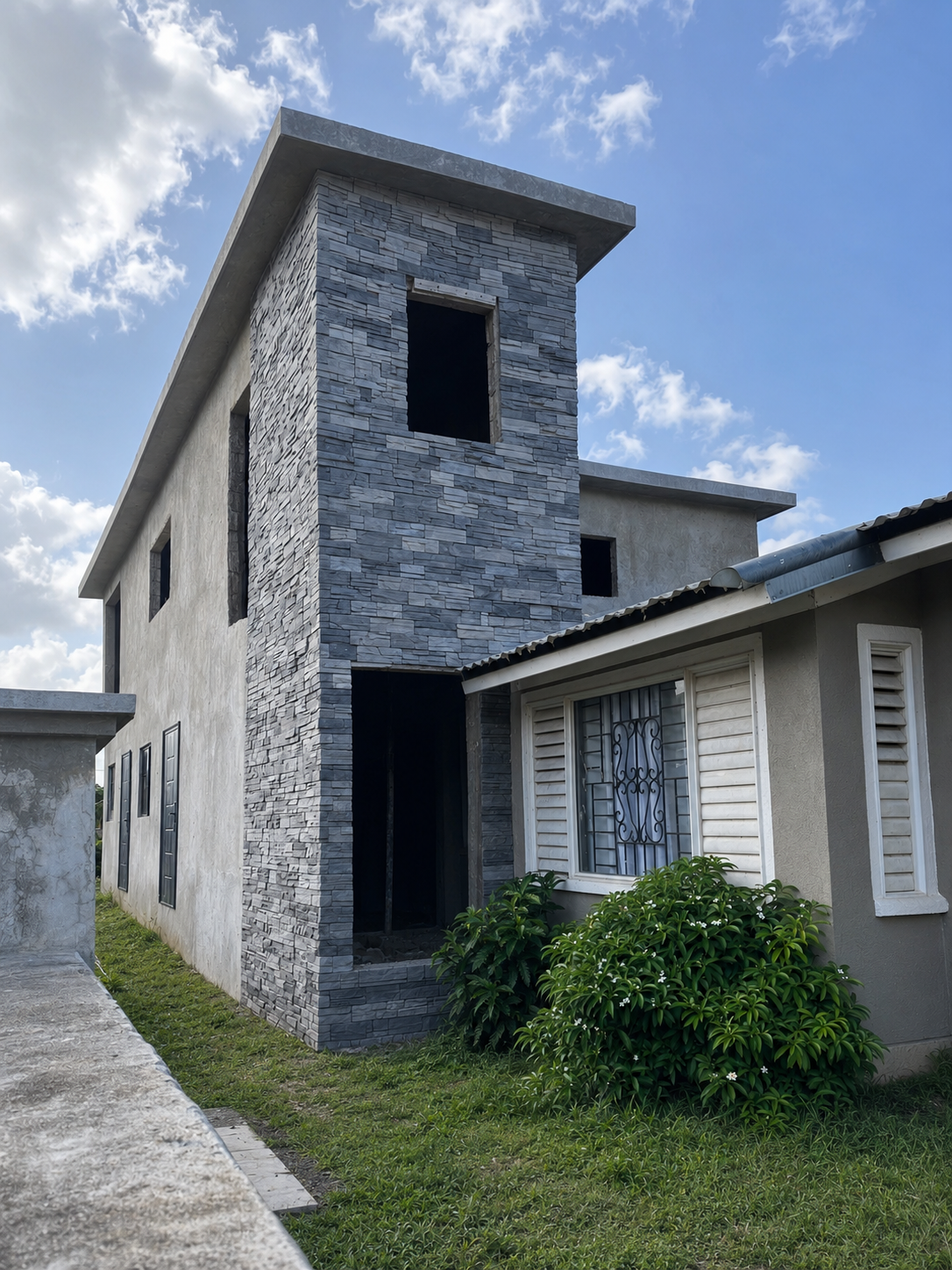 Full-height entrance tower featuring ConCreate Rustic Stone Veneer